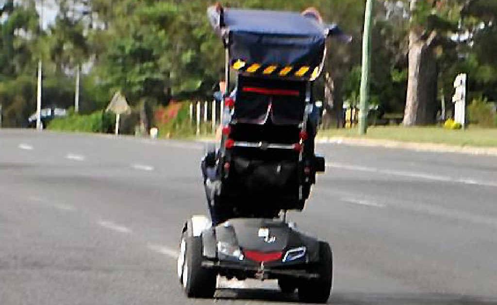 A person in a mobility scooter drives up along Wallace St yesterday. A person in a mobility scooter drives up along Wallace St yesterday.